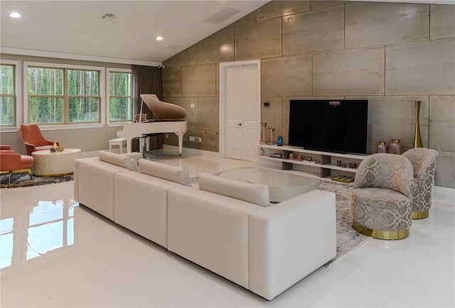 tiled living room featuring lofted ceiling and recessed lighting