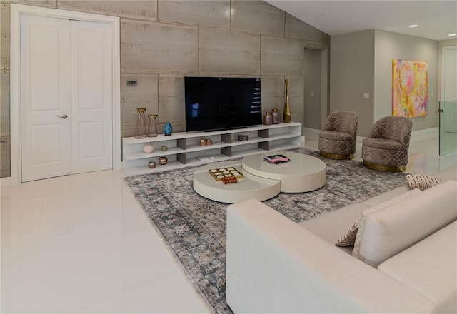 living room with tile patterned floors and recessed lighting