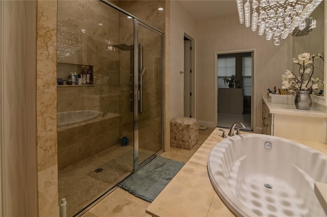 bathroom featuring a bath, a stall shower, and a chandelier