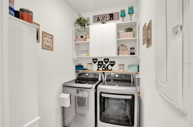 laundry area with cabinet space and independent washer and dryer