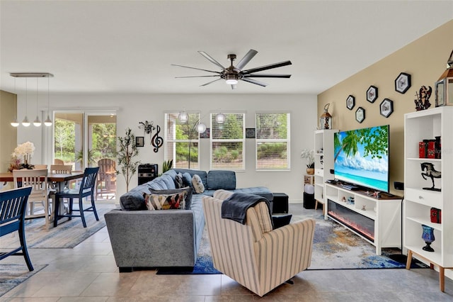 tiled living area featuring ceiling fan