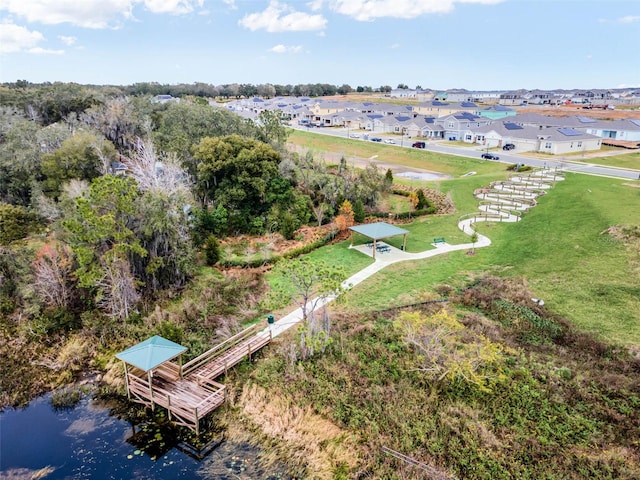 birds eye view of property featuring a water view and a residential view