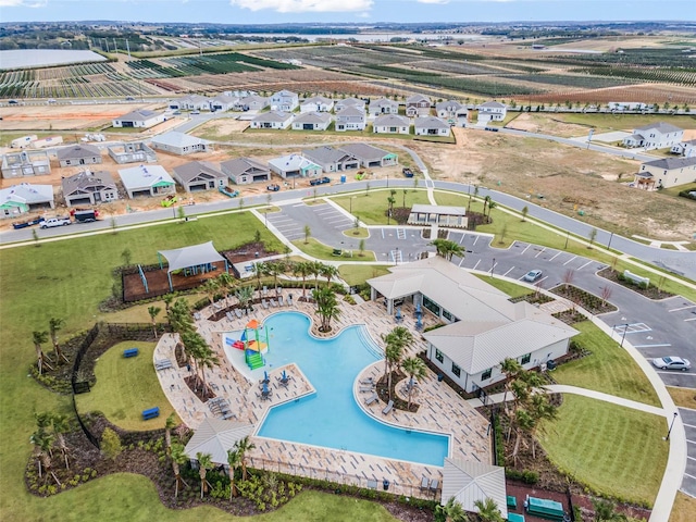 birds eye view of property with a residential view