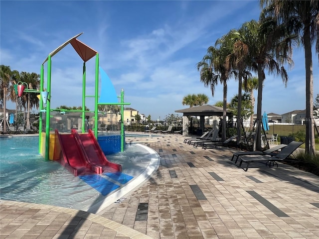 1880 Perch Hammock Loop, Groveland, FL 34736 - view of play area featuring a water play area, a gazebo, a community pool, and a patio area