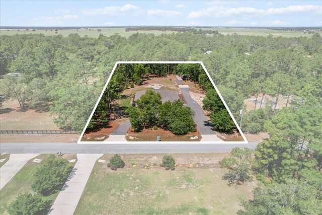 aerial view featuring a wooded view