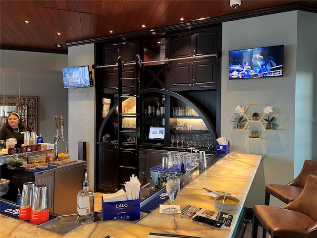 bar with crown molding, wood ceiling, indoor wet bar, and recessed lighting