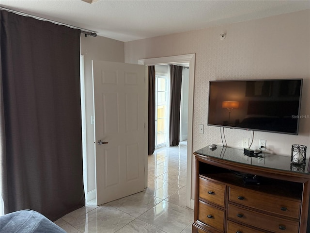 bedroom featuring light tile patterned flooring