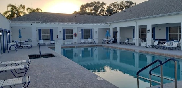 3700 Plantation Blvd, Leesburg, FL 34748 - pool at dusk with a patio and a community pool