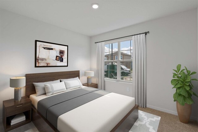 bedroom with carpet floors and baseboards