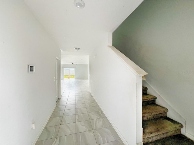 547 Jett Ln, Davenport, FL 33837 - hallway with stairs and baseboards