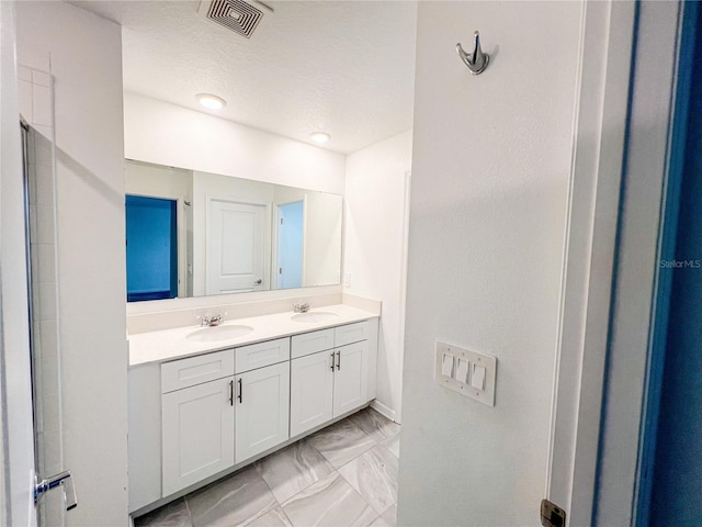 547 Jett Ln, Davenport, FL 33837 - full bathroom with marble finish floors and double vanity