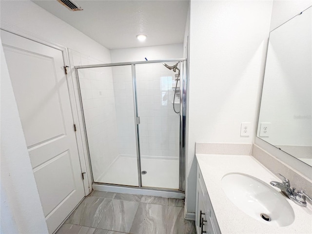 547 Jett Ln, Davenport, FL 33837 - bathroom featuring a stall shower, vanity, and marble finish flooring