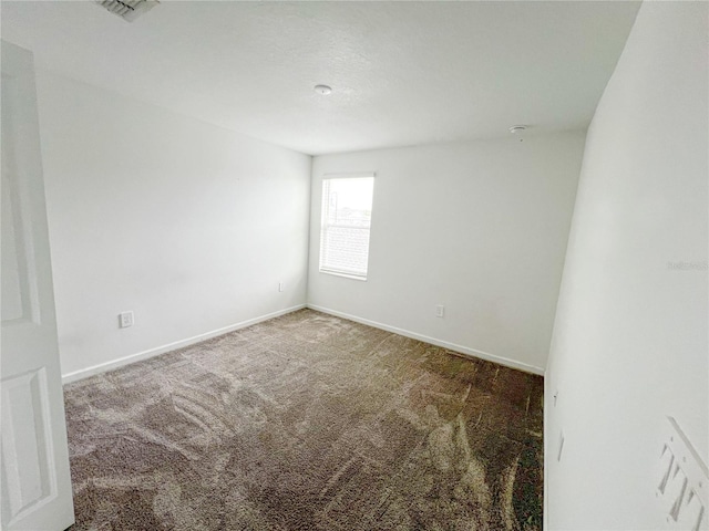 547 Jett Ln, Davenport, FL 33837 - spare room featuring carpet and baseboards