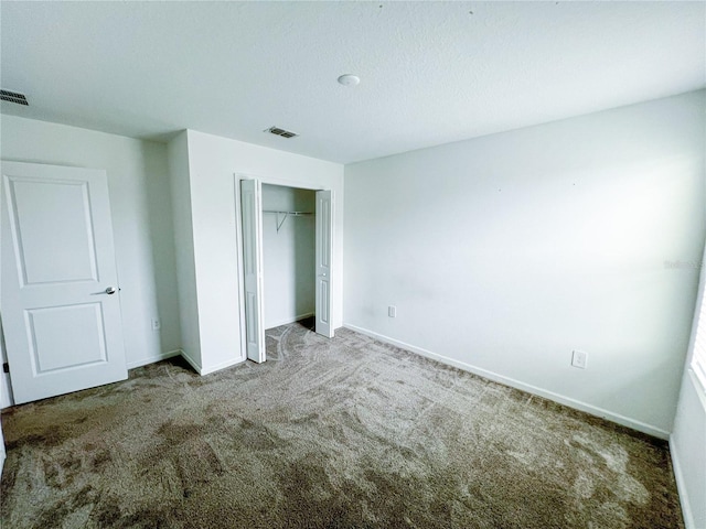 547 Jett Ln, Davenport, FL 33837 - unfurnished bedroom featuring carpet floors and a closet