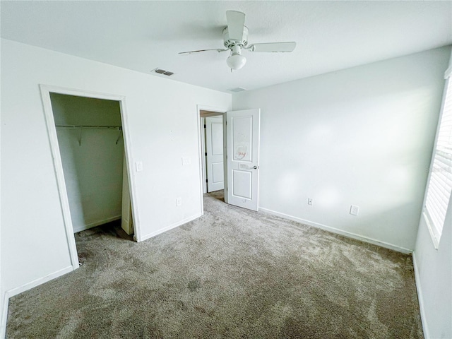 547 Jett Ln, Davenport, FL 33837 - unfurnished bedroom with carpet, ceiling fan, and a closet