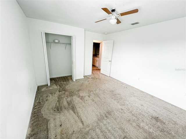 547 Jett Ln, Davenport, FL 33837 - unfurnished bedroom featuring carpet flooring, a closet, and a ceiling fan