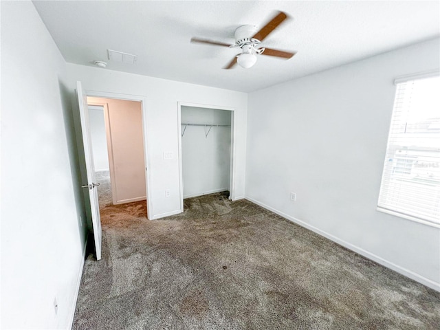 547 Jett Ln, Davenport, FL 33837 - unfurnished bedroom with carpet floors, multiple windows, a closet, and ceiling fan
