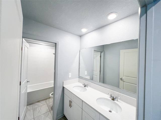 547 Jett Ln, Davenport, FL 33837 - bathroom featuring double vanity, a textured ceiling, marble look tile flooring, and  shower combination