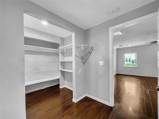 spacious closet with hardwood / wood-style flooring and visible vents