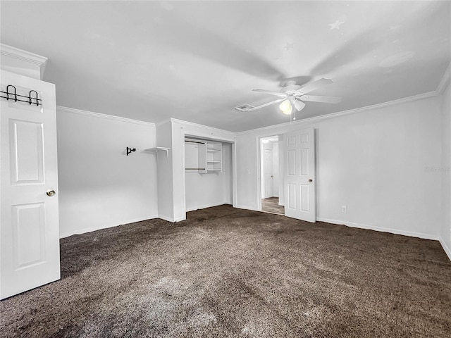 unfurnished bedroom featuring baseboards, ornamental molding, carpet, and a closet