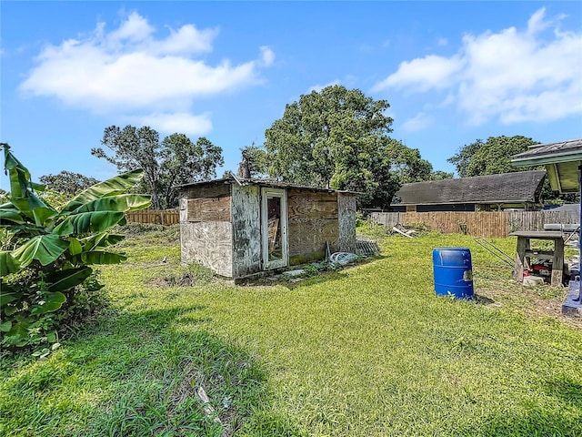 view of shed featuring fence