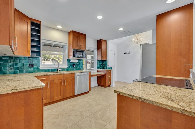 1231 Glastonberry Rd, Maitland, FL 32751 - kitchen featuring recessed lighting, brown cabinets, tasteful backsplash, a sink, and stainless steel appliances