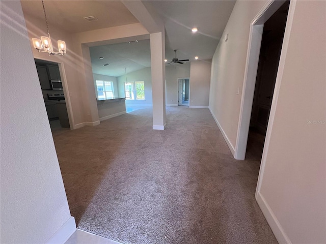 4264 Sagefield Dr, Saint Cloud, FL 34773 - hall with visible vents, vaulted ceiling, baseboards, an inviting chandelier, and carpet flooring