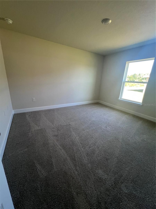 4264 Sagefield Dr, Saint Cloud, FL 34773 - spare room with baseboards and carpet