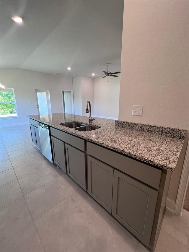 4264 Sagefield Dr, Saint Cloud, FL 34773 - kitchen featuring stainless steel dishwasher, light stone countertops, a sink, light tile patterned floors, and gray cabinetry