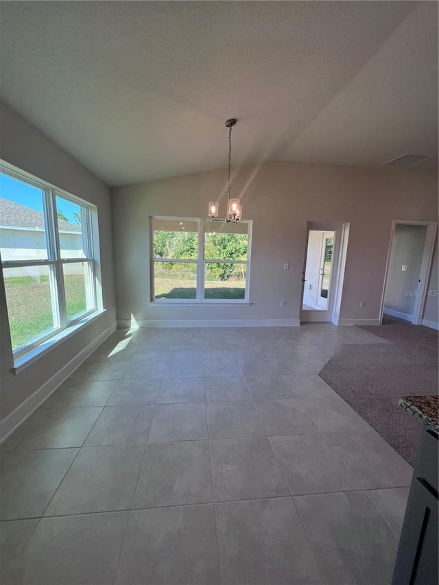 4264 Sagefield Dr, Saint Cloud, FL 34773 - unfurnished dining area with baseboards, vaulted ceiling, tile patterned floors, and a chandelier