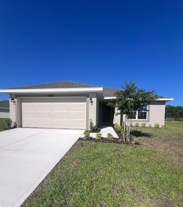 4264 Sagefield Dr, Saint Cloud, FL 34773 - view of front of home featuring stucco siding, an attached garage, driveway, and a front yard