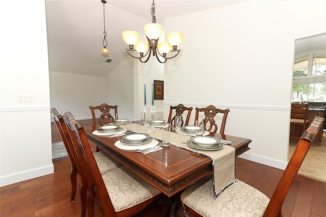 dining area featuring baseboards, dark wood finished floors, lofted ceiling, and a notable chandelier