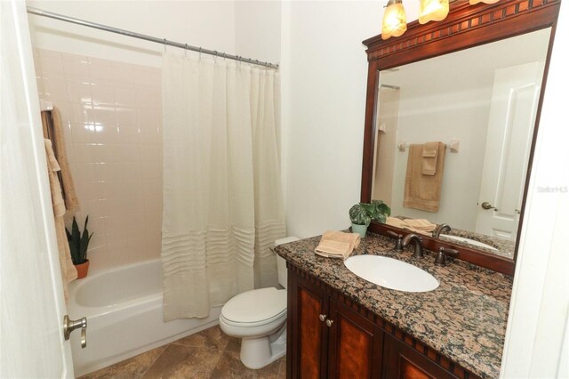 bathroom with vanity, toilet, and shower / tub combo