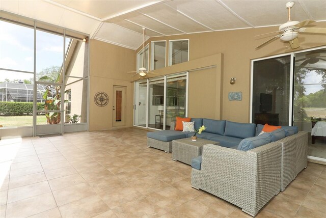 sunroom / solarium with an outdoor hangout area and a ceiling fan