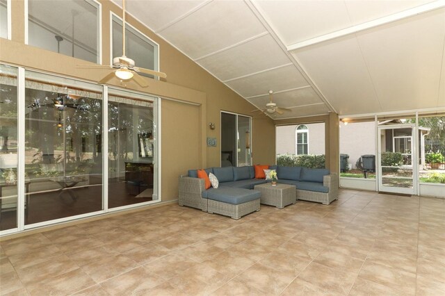 sunroom with plenty of natural light, ceiling fan, and an outdoor living space