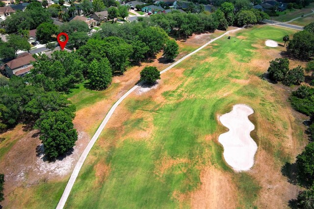 drone / aerial view featuring a residential view and view of golf course