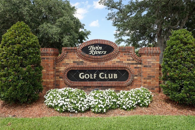 community / neighborhood sign with a garage