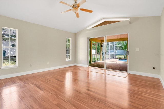 1512 Adriatic Dr, Ocoee, FL 34761 - unfurnished room featuring baseboards, ceiling fan, wood finished floors, and lofted ceiling