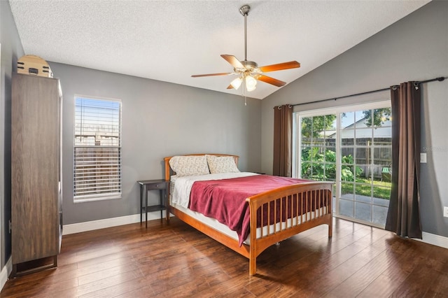 bedroom featuring baseboards, vaulted ceiling, hardwood / wood-style floors, and access to exterior