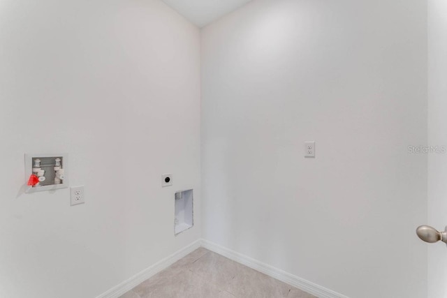 laundry room featuring laundry area, baseboards, hookup for a washing machine, light tile patterned floors, and hookup for an electric dryer