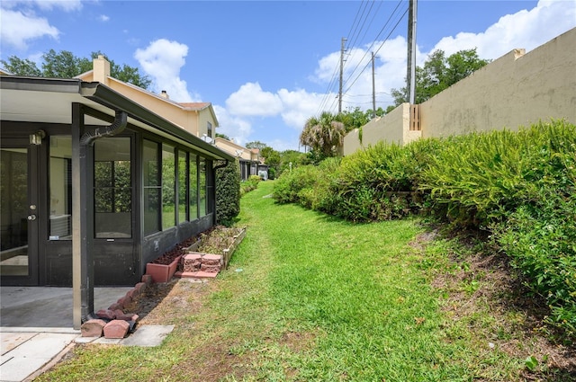view of yard with a sunroom