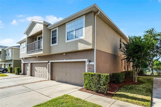 3917 Pemberly Pines Cir, Saint Cloud, FL 34769 - view of front facade with an attached garage, driveway, and stucco siding