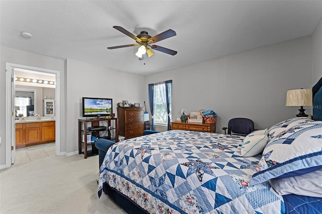 3917 Pemberly Pines Cir, Saint Cloud, FL 34769 - bedroom with baseboards, a ceiling fan, ensuite bathroom, and light carpet