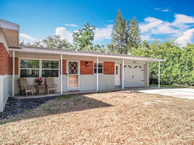 2631 Mcdonald Ter, Mount Dora, FL 32757 - exterior space with brick siding, an attached garage, and driveway