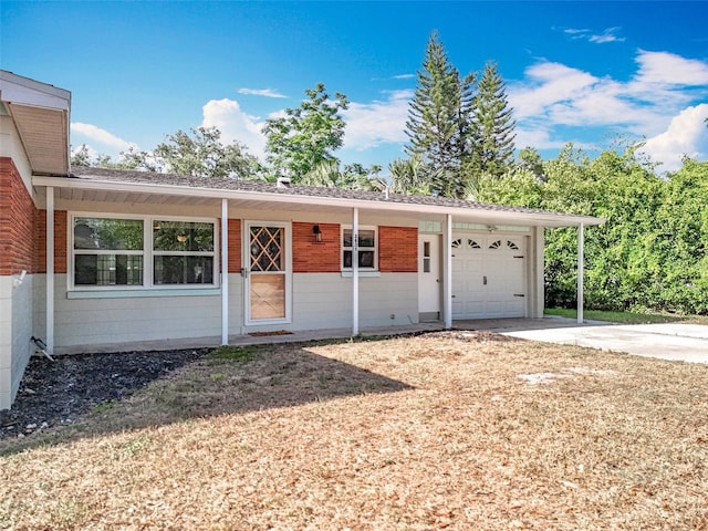 2631 Mcdonald Ter, Mount Dora, FL 32757 - view of front facade with a garage, concrete driveway, and brick siding