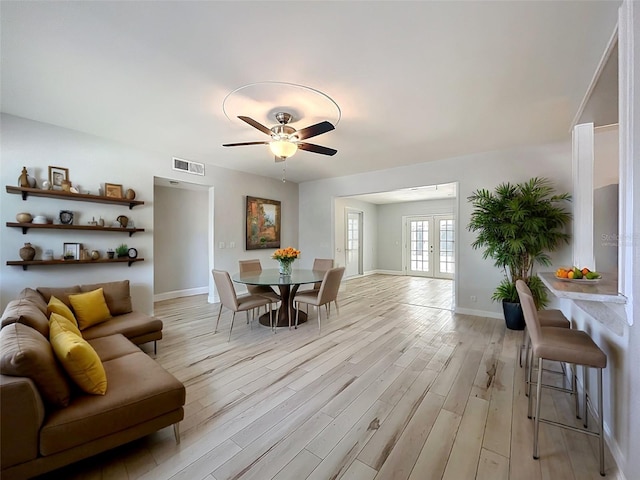2631 Mcdonald Ter, Mount Dora, FL 32757 - dining space featuring ceiling fan, visible vents, baseboards, and light wood finished floors
