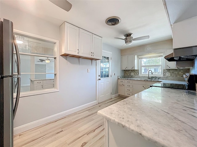 2631 Mcdonald Ter, Mount Dora, FL 32757 - kitchen featuring a sink, appliances with stainless steel finishes, ceiling fan, and light wood-type flooring