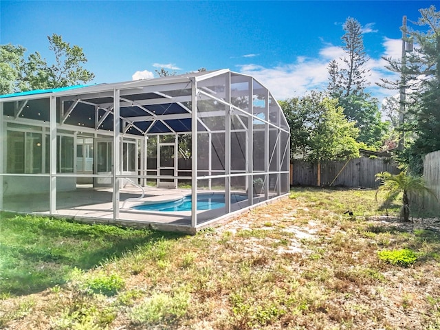 2631 Mcdonald Ter, Mount Dora, FL 32757 - view of pool featuring a patio, a fenced backyard, a fenced in pool, glass enclosure, and a yard