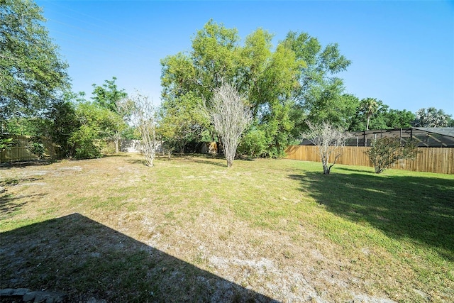 view of yard with a fenced backyard