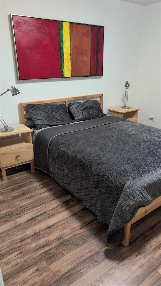 bedroom with wood finished floors